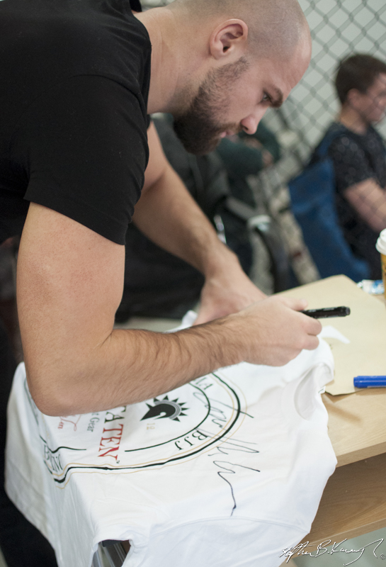 Cathal Pendred signs the Spatraten T-Shirt of Stephen Meagher at the opening of the new Straight Blast Gym branch on the Naas Road, Dublin. 11th January 2014